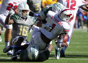 SMU Mustangs wide receiver Kevin Thomas (1) is tackled by two Baylor Bears defenders in the third quarter at McLane Stadium in Waco, Texas.